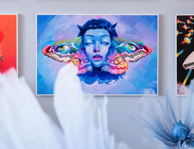 Colourful gallery wall with modern and surreal wall art in vibrant colours