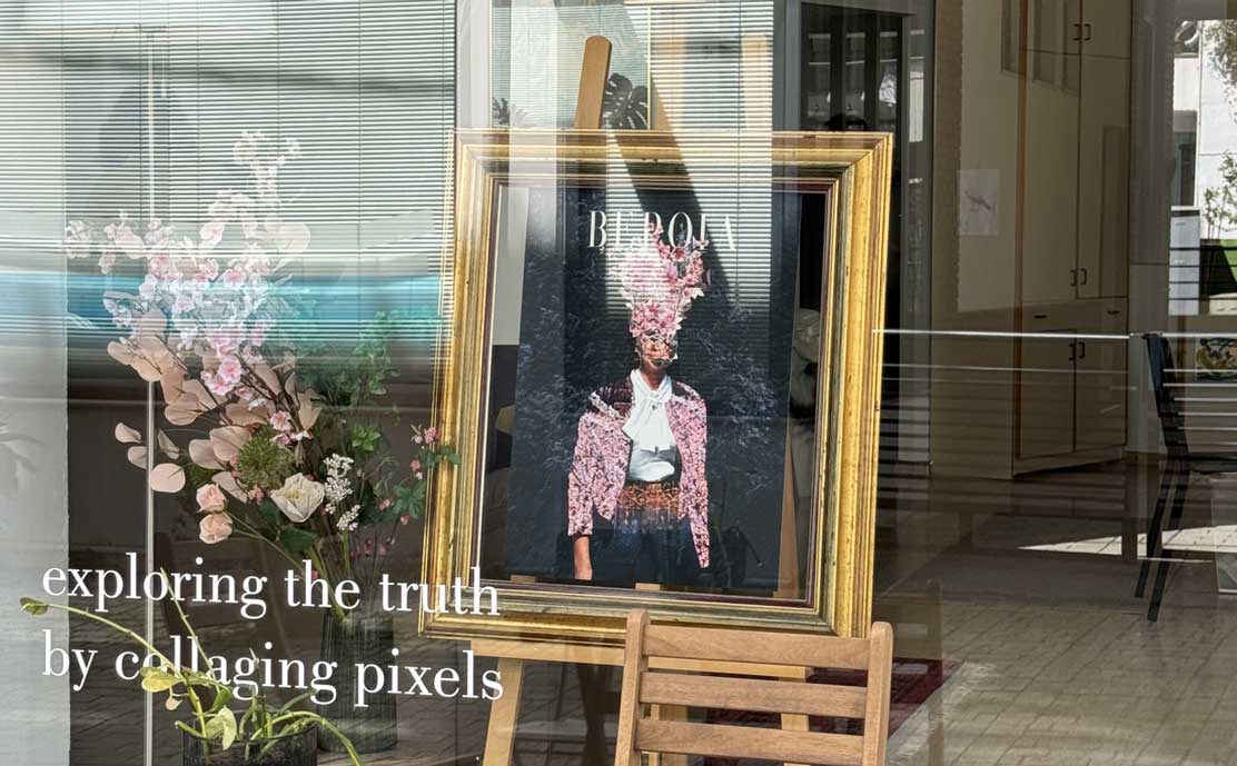 Framed artwork by Frank Moth with floral collage in a shop window, text: ‘exploring the truth by collaging pixels’ Framed artwork by Frank Moth with floral collage in a shop window, text: ‘exploring the truth by collaging pixels’