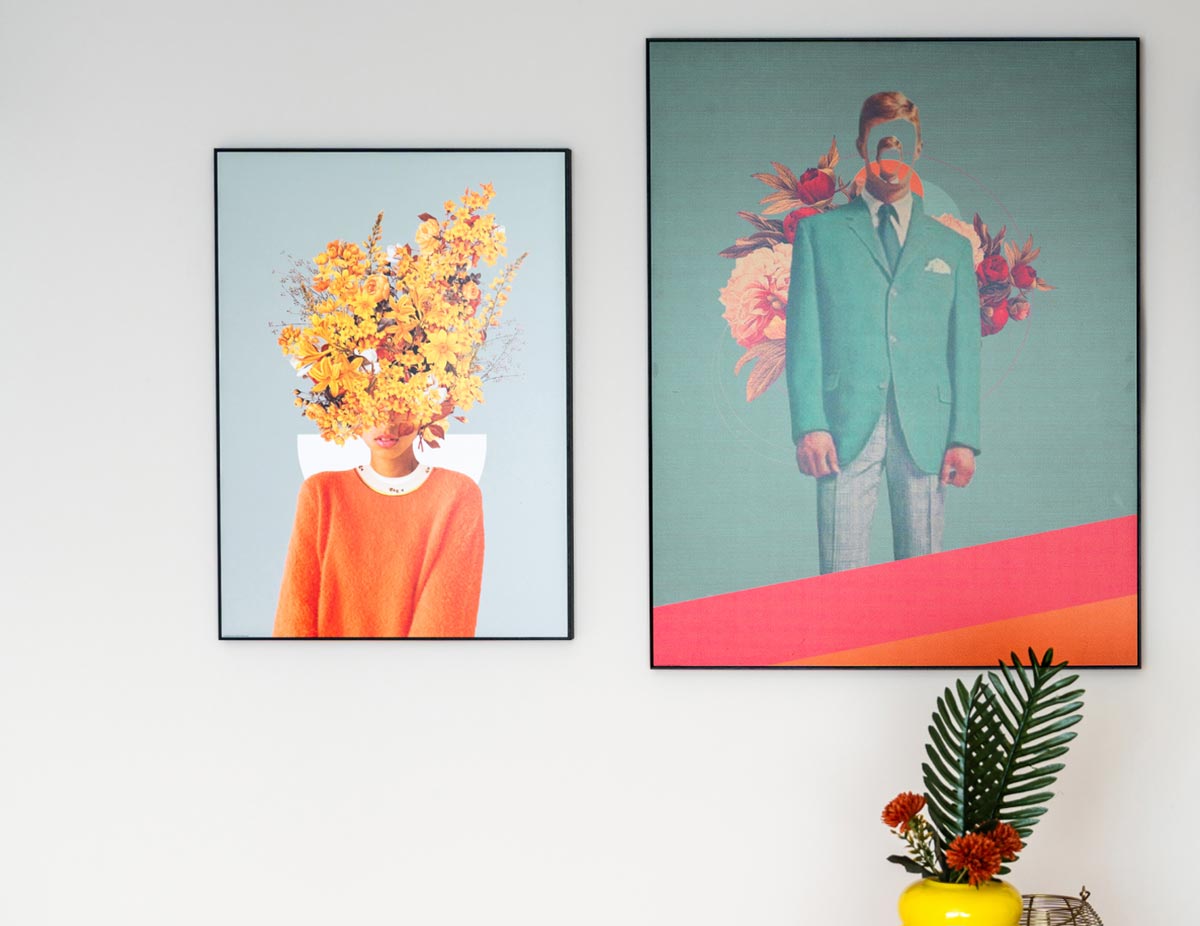 Two surrealist artworks on the wall – left: a portrait with yellow flowers instead of a head, right: a suited man with a floral collage in the background